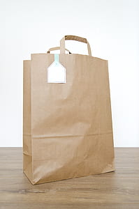 brown paper bag on brown wooden surface thumbnail