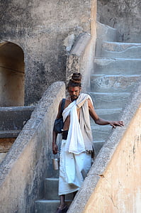 man walking on concrete stairs thumbnail