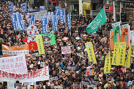 people holding flags during daytime thumbnail