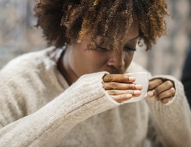 woman in white sweater drinking coffee thumbnail