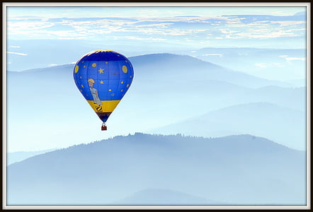 flying blue and yellow hot air balloon thumbnail