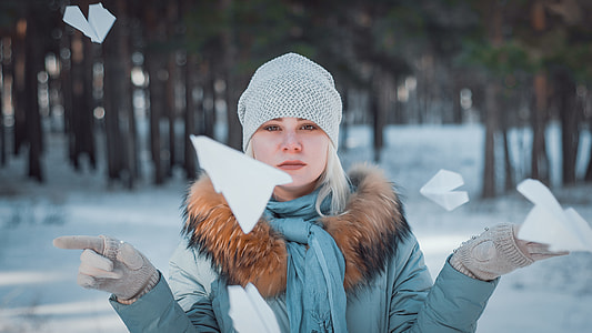 woman holding paper airplane thumbnail
