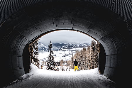 person standing near tunnel with snow thumbnail