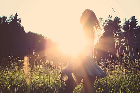 Girl Playing With Sunshine In A Meadow Field thumbnail
