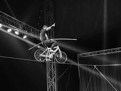 man riding bicycle on cable thumbnail