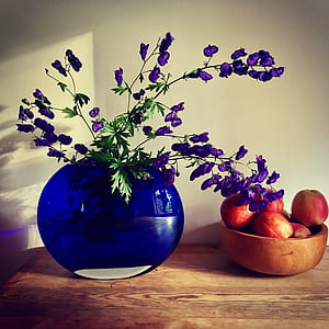 Purple Petaled Flower Arrangement Near Apple Fruit on Table thumbnail