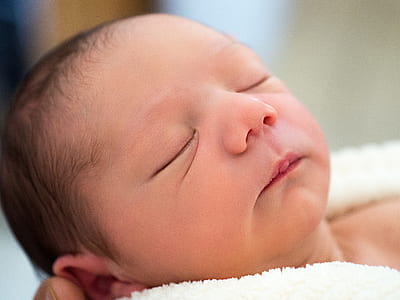 newborn baby closing its eyes thumbnail