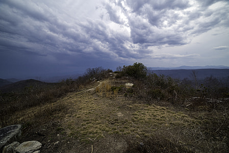 Mound at the Hilltop under lingering storm clouds at Sassafras Mountain, South Carolina thumbnail