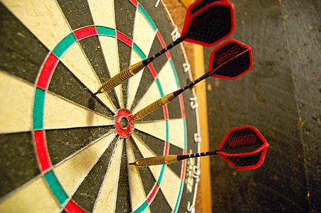 three red darts on dartboard thumbnail