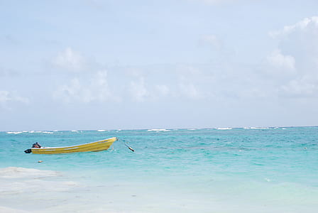 yellow jon boat in body of water thumbnail