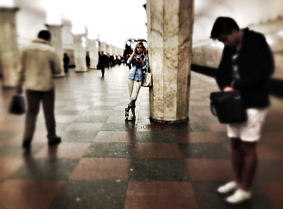 woman standing beside pillar thumbnail