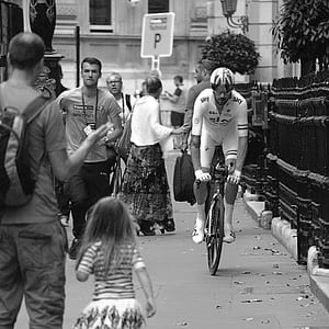 man cycling near people thumbnail