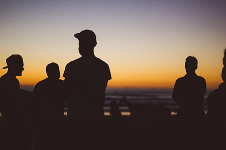 silhouette photography of five person gathered together thumbnail