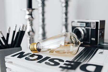 Pencils, magazines and an old lightbulb thumbnail