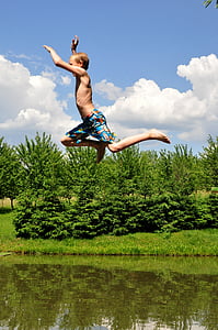 man jumping over body of water thumbnail