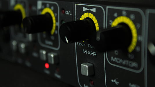 macro shot photography of black and yellow equalizer button thumbnail