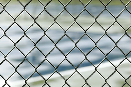 selective focus photography of chain fence thumbnail