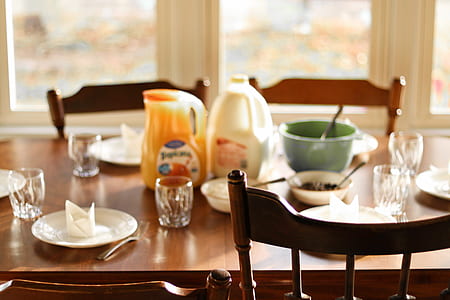 white plastic container on top brown table thumbnail