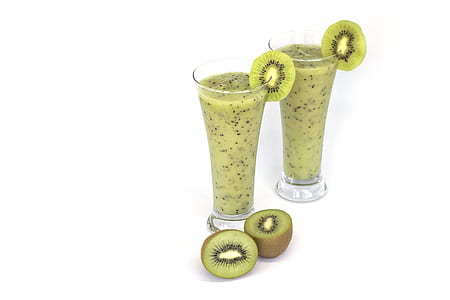 two kiwi shakes in clear drinking glasses on white surface thumbnail