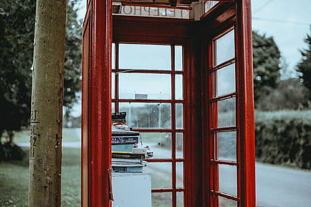 shallow focus photo of red telephone booth thumbnail