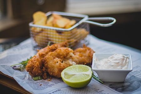 Fried Meat Beside Sliced Lemon and White Mustard thumbnail