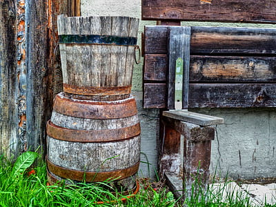 brown wooden bucket on top of wooden drum thumbnail