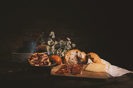 bread on brown wooden chopping board thumbnail