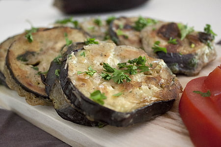 sushi dish garnish with green leaf spice with tomato on side thumbnail