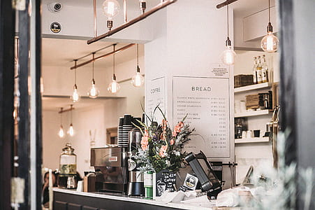 Inside the Restaurant With Pendant Lamps and Flowers thumbnail