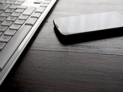 black smartphone on table thumbnail