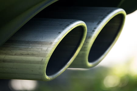closeup photo of vehicle mufflers thumbnail
