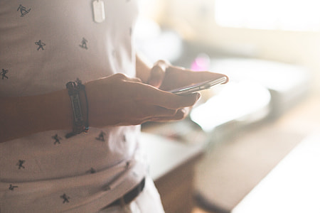Man Instant Messaging on his iPhone 6 thumbnail