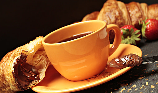 photo of brown ceramic coffee mug on saucer thumbnail
