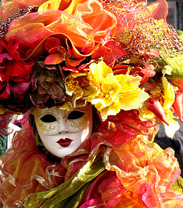 white mask surrounded by artificial flowers thumbnail