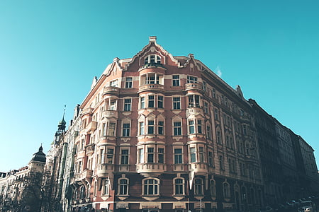 architectural photography of brown concrete building thumbnail