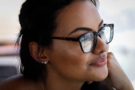 close up photo of woman wearing eyeglasses smiling thumbnail