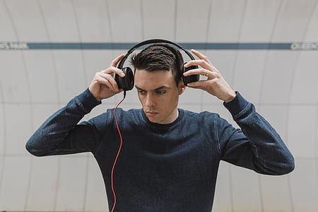 photo of man about to wear headphones thumbnail