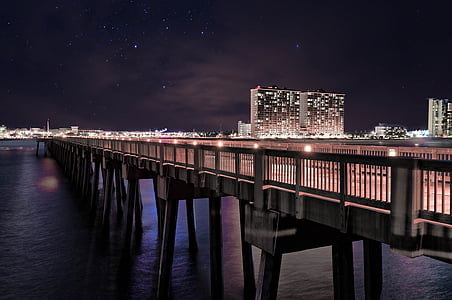 brown concrete bridge at night thumbnail