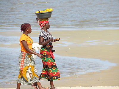 two women walking beach shore thumbnail