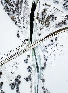 aerial view photography of bridge between snowfield thumbnail