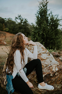 woman wearing white long-sleeved shirt during daytime thumbnail