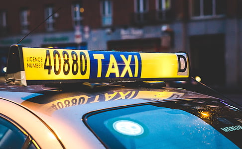 yellow and blue taxi light signage thumbnail