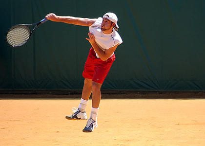 man wearing white shirt and red shorts thumbnail