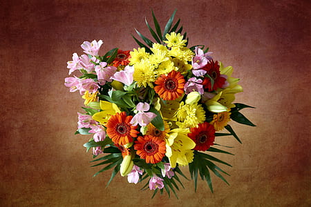 close-up photograph of yellow and orange petaled flower arrangement thumbnail