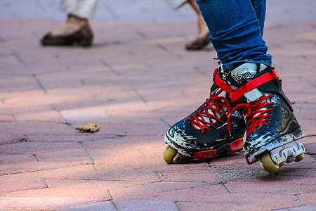 person wearing blue inline skates thumbnail