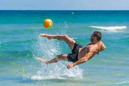 man kicked ball on body of water thumbnail