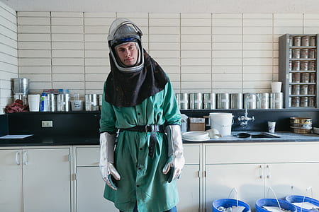 man wearing bee suit standing near gray stainless steel container lot thumbnail