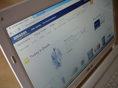 white Asus laptop displaying Amazon site thumbnail