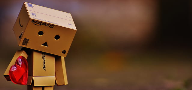 selective focus photography of Boxman holding heart thumbnail