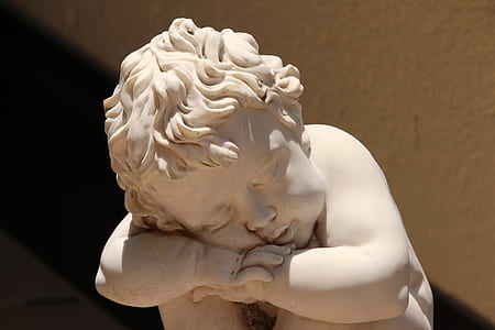 white cherub figurine thumbnail